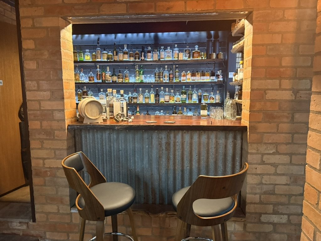 The Blind Pig bar window and whisky shelves